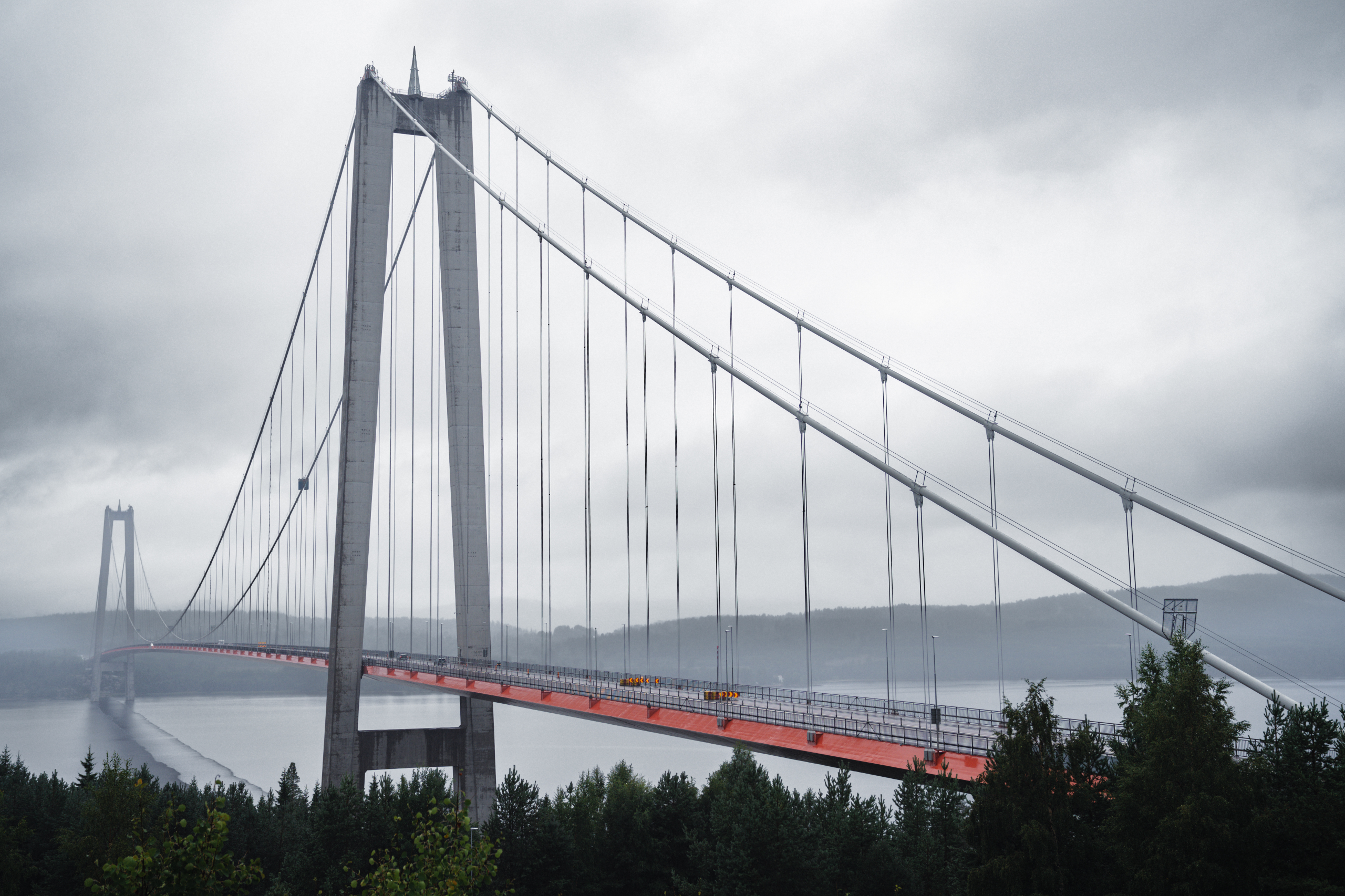 Bridge over a river in the rain on a dark day