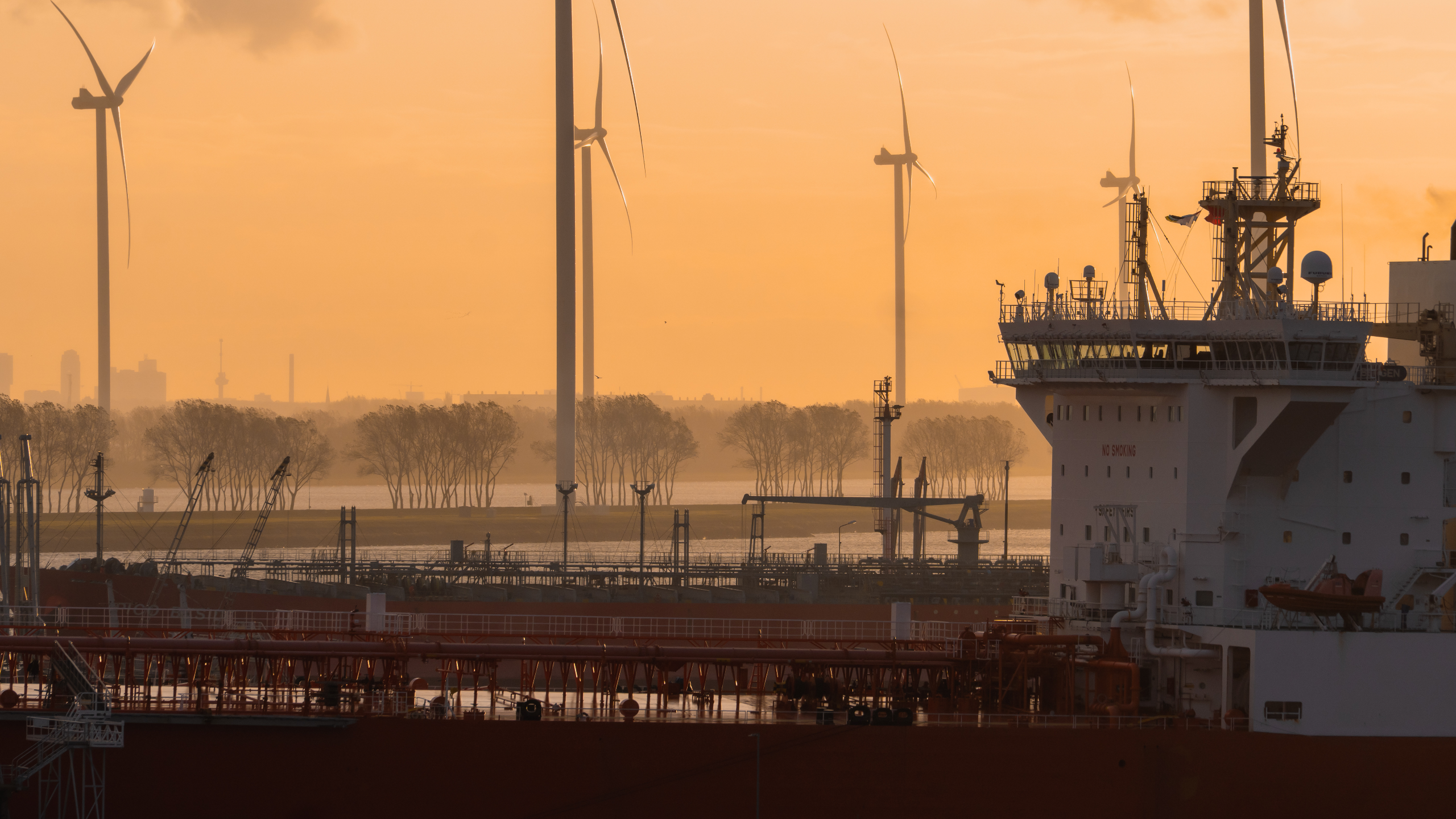 Wind turbines in the morning mist of the sun rising